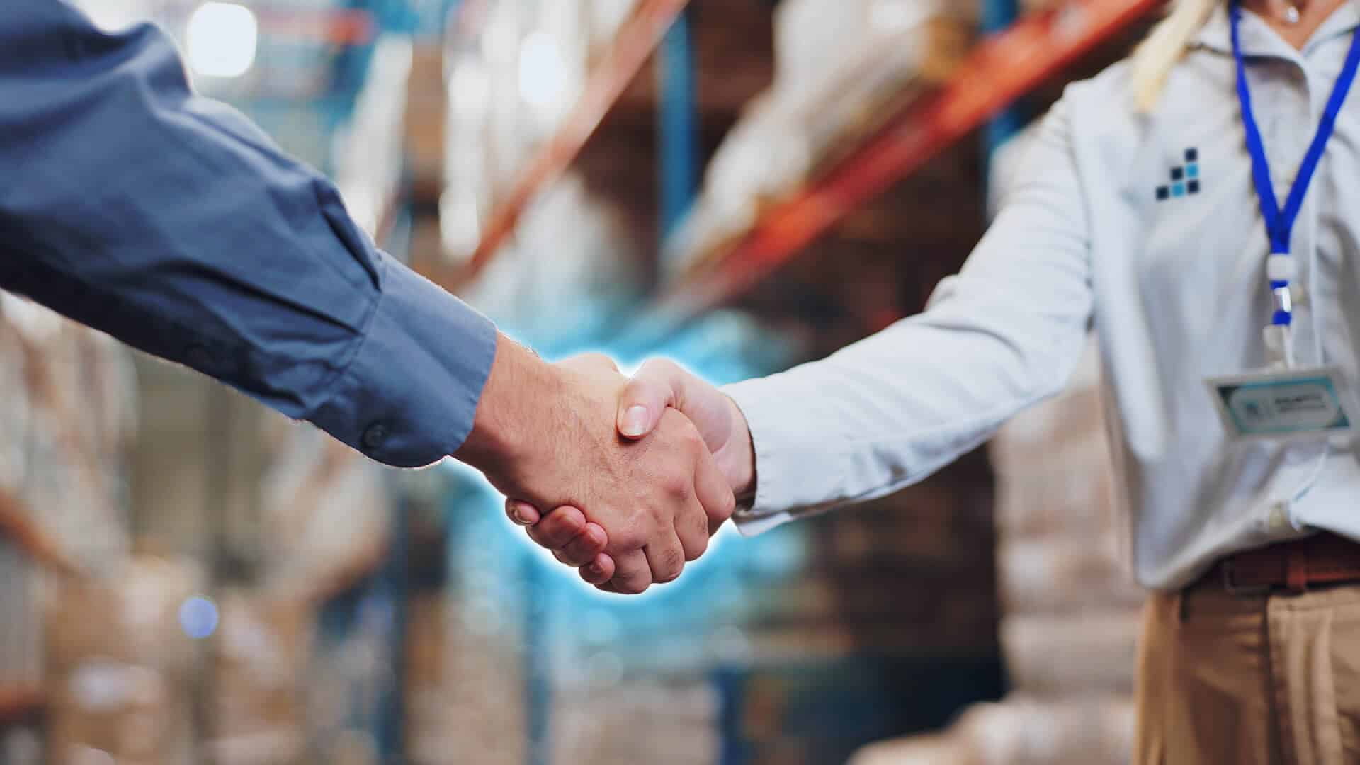 Logistics partner shaking hands for a deal for import and exports of cargo, customs clearance